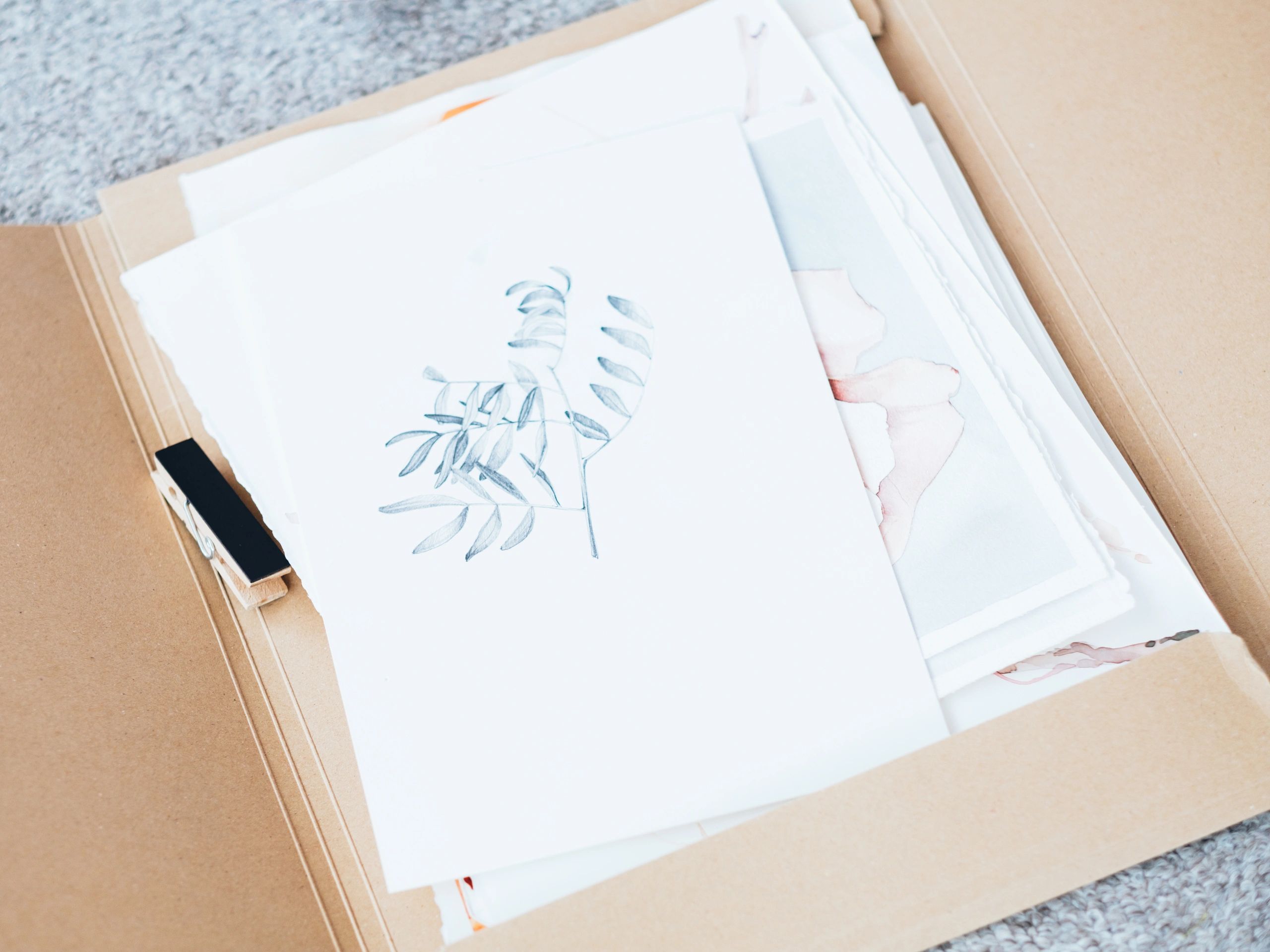 Folder with floral student artwork