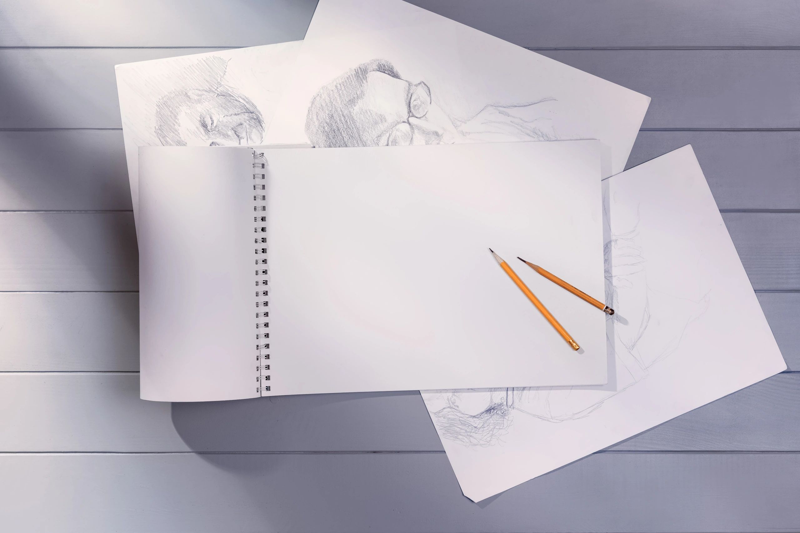 Art studio workspace with drawing sheets