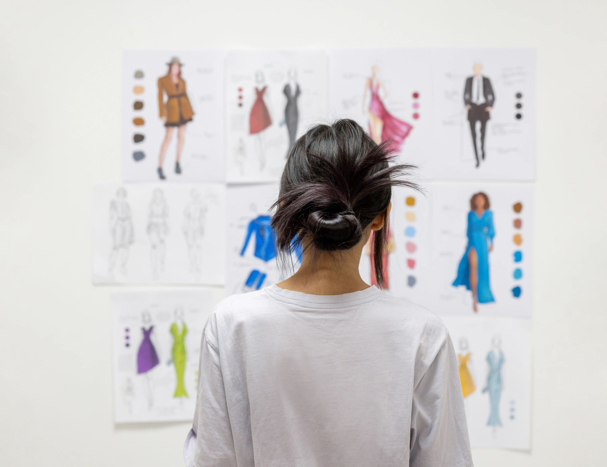 Design student reviewing sketches